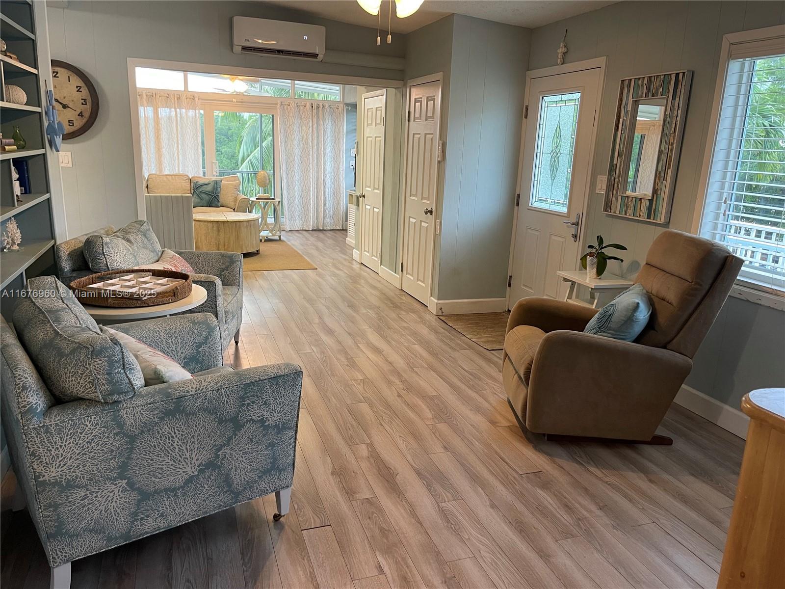 39 Lake Shore Drive Key Largo, FL 33037 - Photo 5 of 27 a living room with furniture and a large window