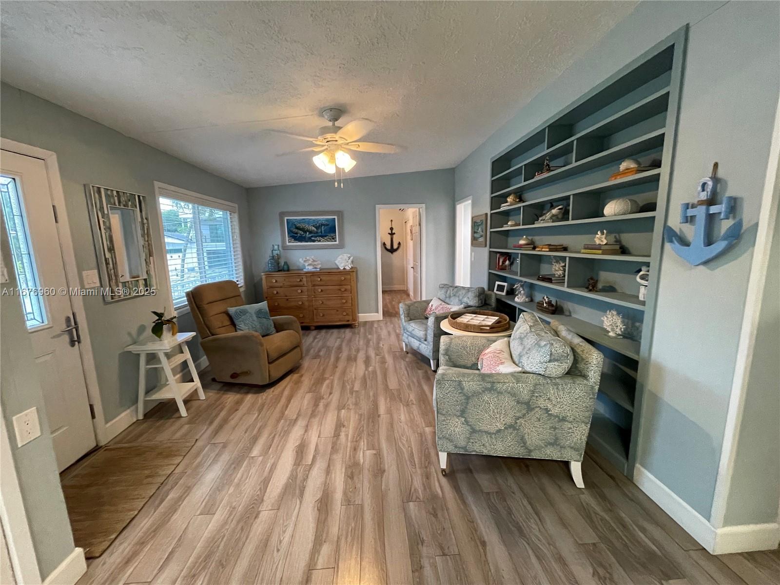 39 Lake Shore Drive Key Largo, FL 33037 - Photo 7 of 27 a living room with furniture and a wooden floor
