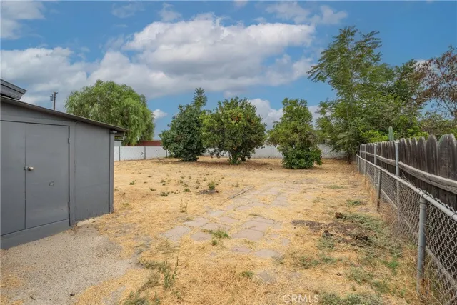 a view of wooden fence and trees