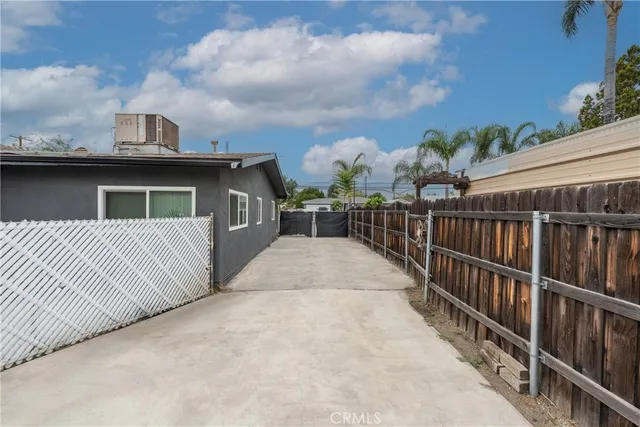 a view of a house with wooden deck