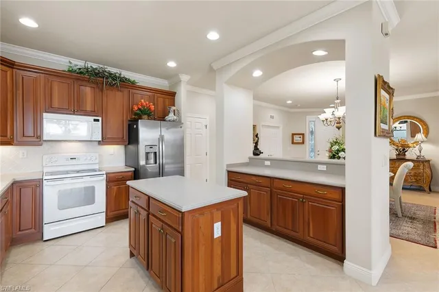 a kitchen with a sink stove and refrigerator