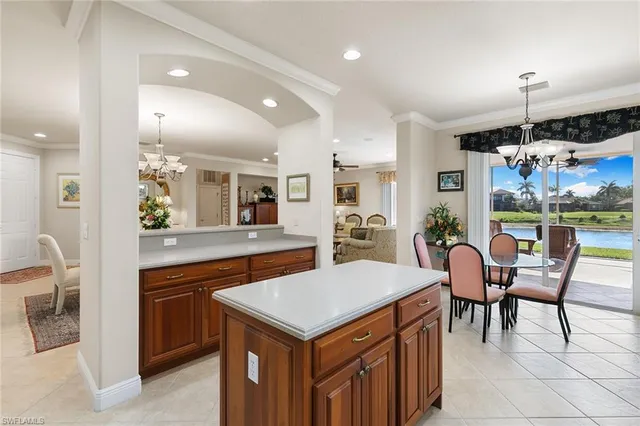a kitchen with a table and chairs in it