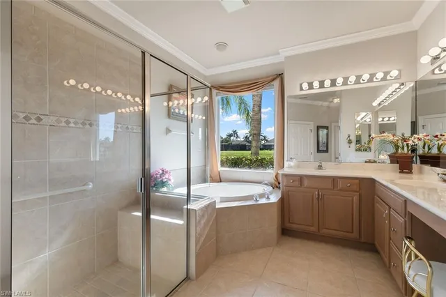 a large spacious bathroom with a large tub shower and sink