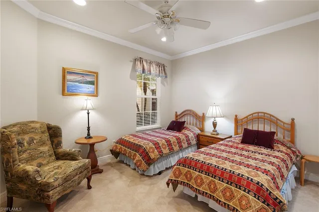 a bedroom with two beds and a couch