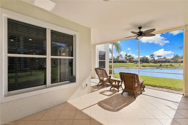 a view of a patio with a dining table and chairs with wooden floor