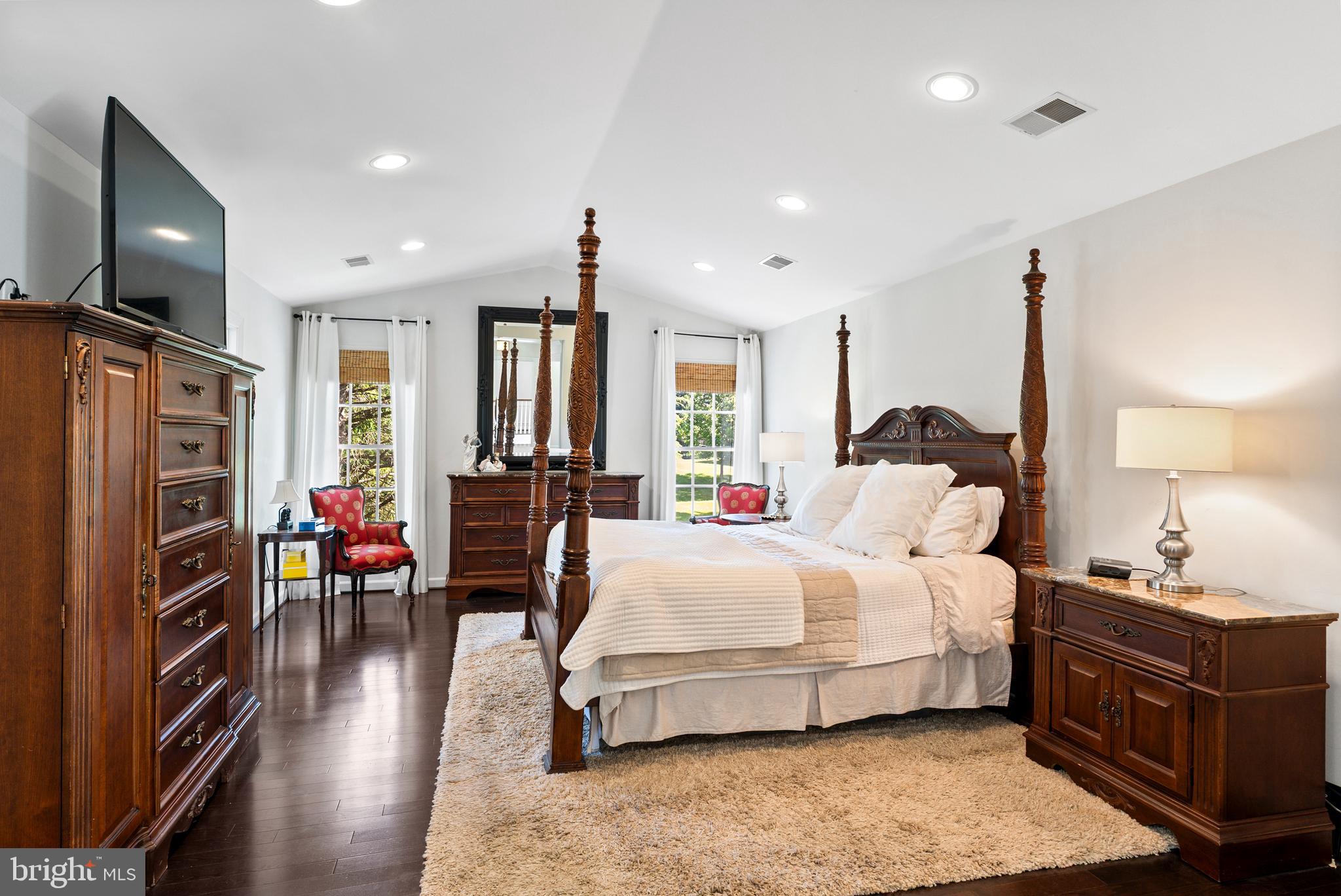 7 Redtree Lane Reisterstown, MD 21136 - Photo 32 of 56 a bedroom with a bed closet and a flat tv screen