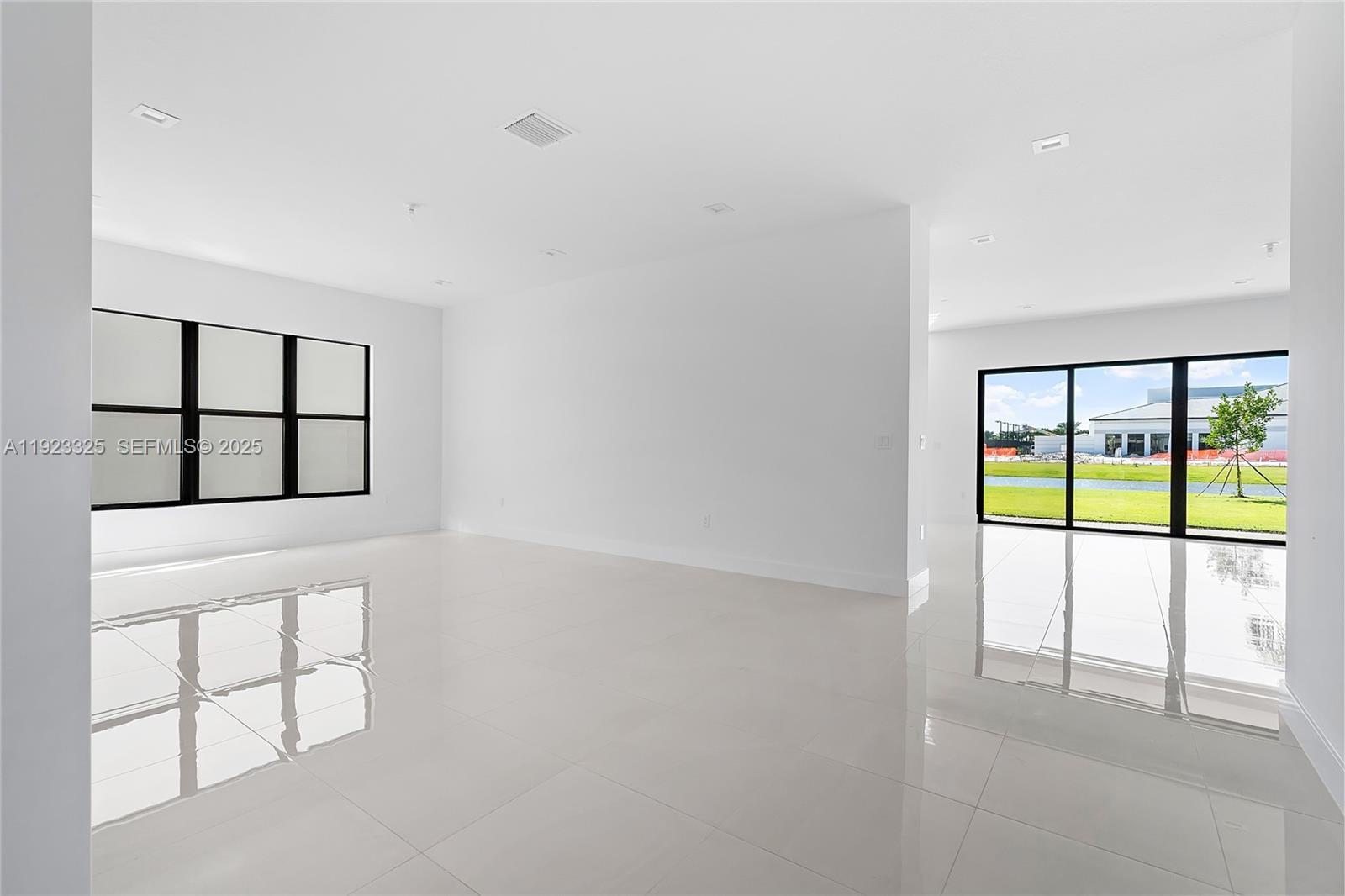 9362 Tulip Leaf Court, Unit 9362 Boca Raton, FL 33434 - Photo 11 of 80 an empty room with windows