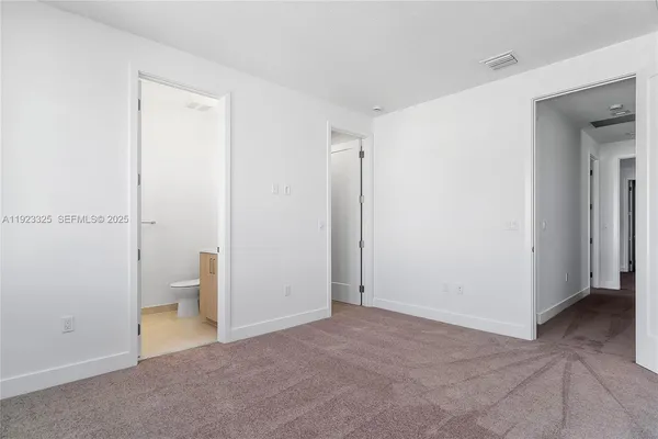 a bathroom with a double vanity sink toilet mirror and bathtub