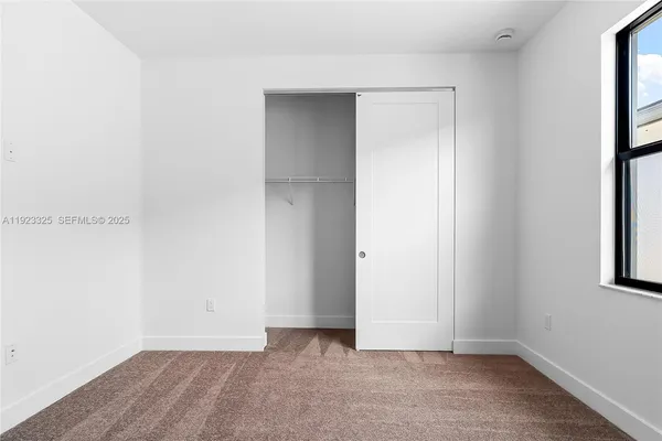 a view of a hallway with front door