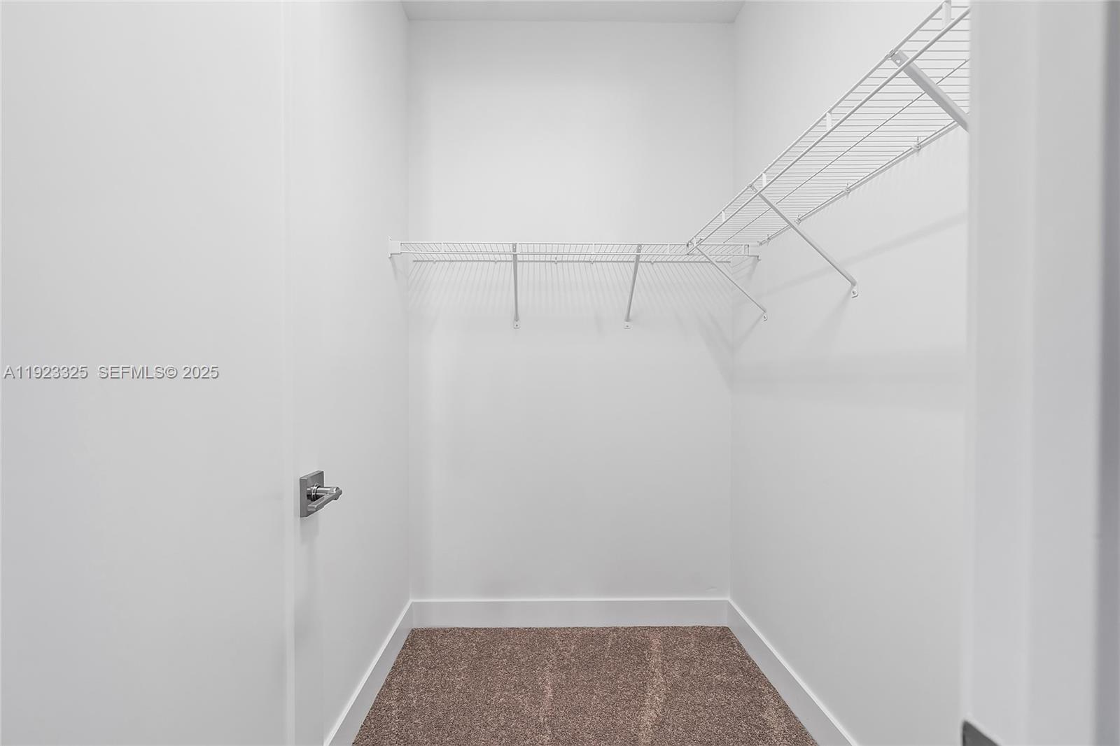 9362 Tulip Leaf Court, Unit 9362 Boca Raton, FL 33434 - Photo 27 of 80 a view of storage and utility room with racks on the wall