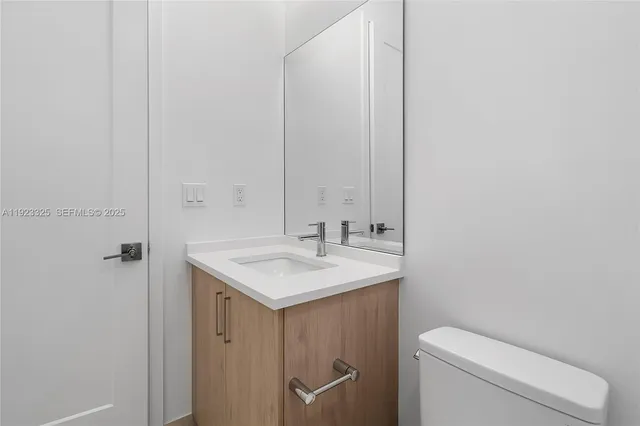 a house with a yard and a large tree