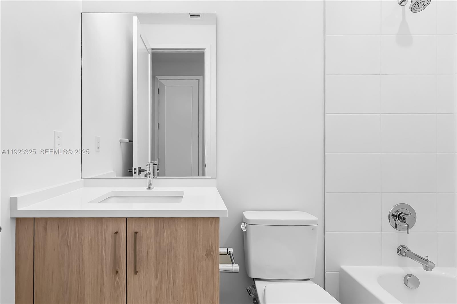 9362 Tulip Leaf Court, Unit 9362 Boca Raton, FL 33434 - Photo 44 of 80 a bathroom with a sink a toilet and shower