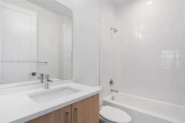 an aerial view of a house with a garden