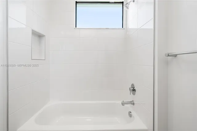 an aerial view of residential houses with swimming pool