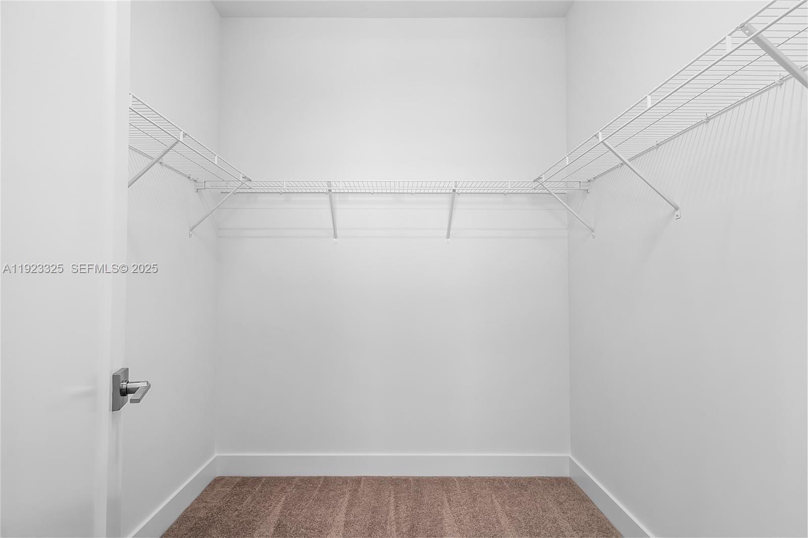 9362 Tulip Leaf Court, Unit 9362 Boca Raton, FL 33434 - Photo 51 of 80 a view of a room with racks on the wall