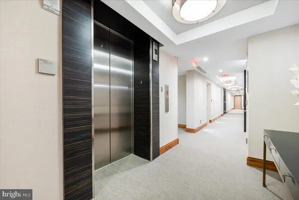 a view of a hallway with staircase