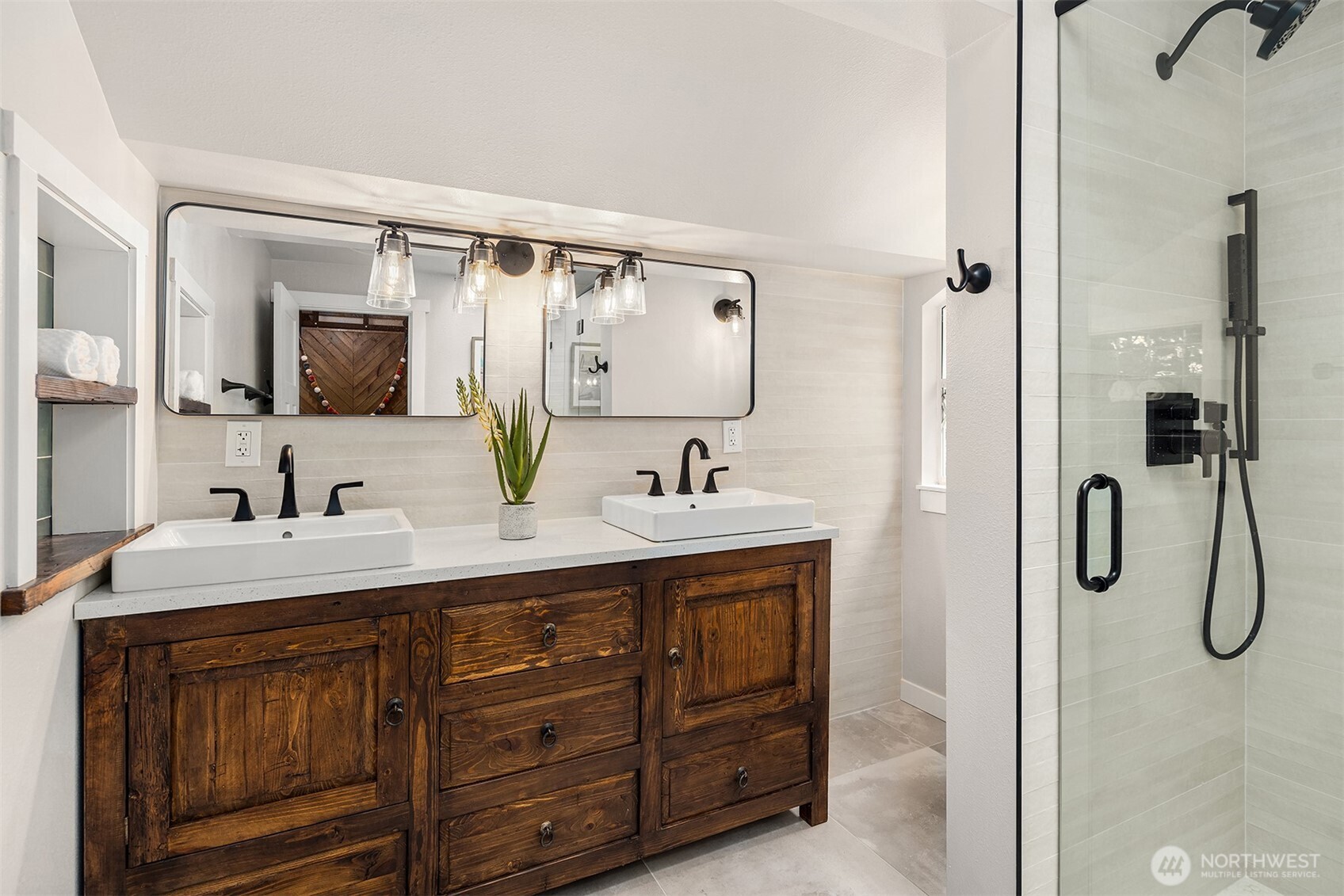 4938 Narbeck Avenue Everett, WA 98203 - Photo 18 of 40 a bathroom with a double vanity sink double and mirror
