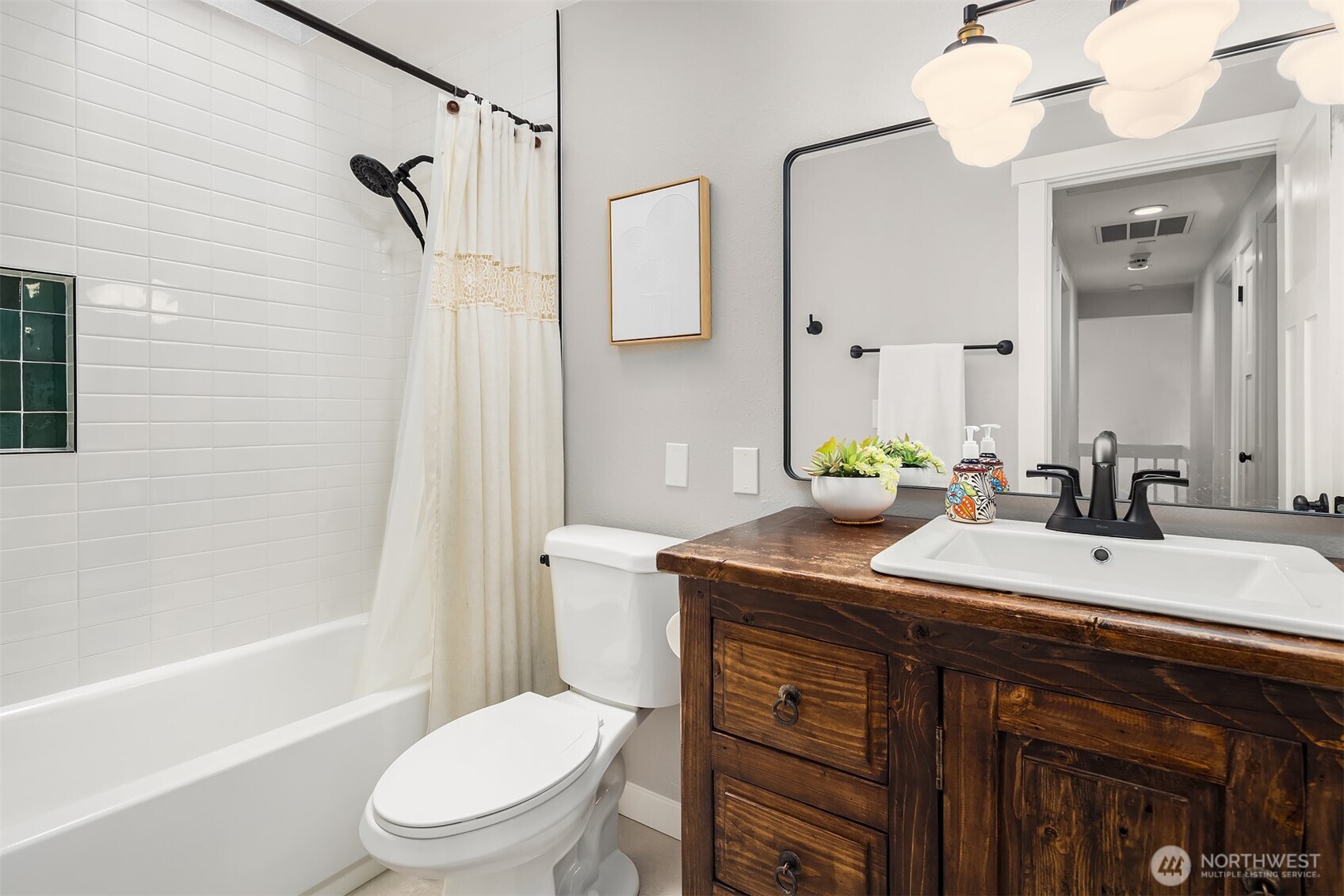 4938 Narbeck Avenue Everett, WA 98203 - Photo 22 of 40 a bathroom with a granite countertop sink toilet a mirror and shower