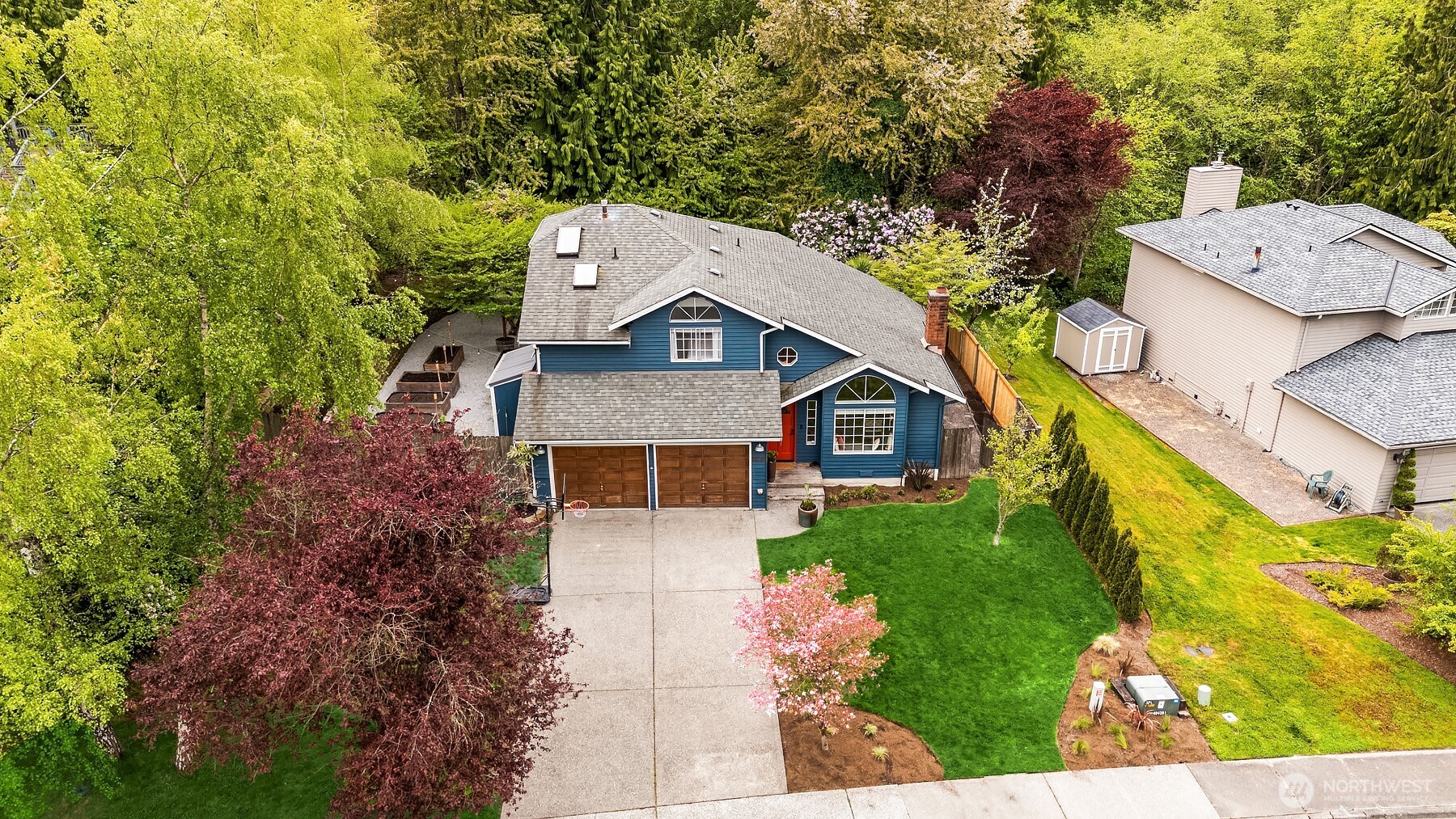 4938 Narbeck Avenue Everett, WA 98203 - Photo 33 of 40 a aerial view of a house with a yard and large trees