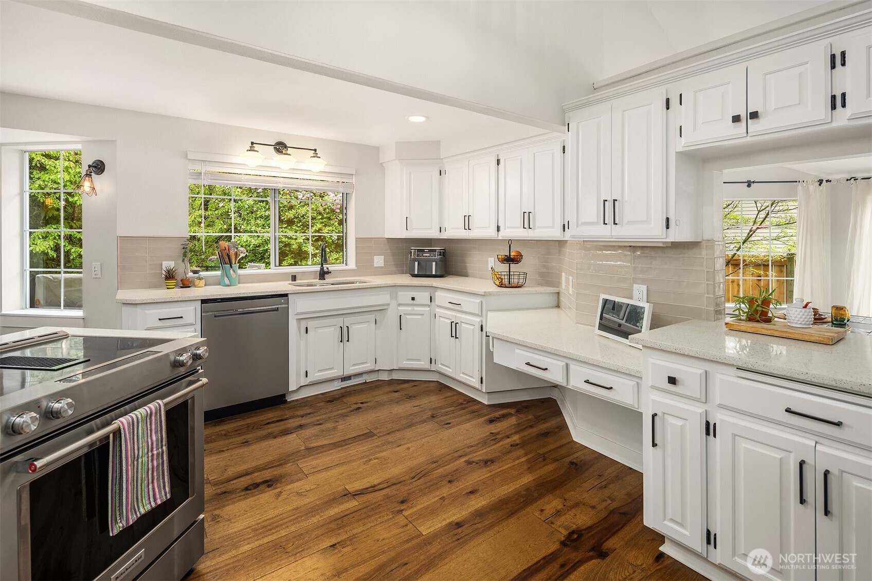 4938 Narbeck Avenue Everett, WA 98203 - Photo 7 of 40 a kitchen with a stove sink and cabinets