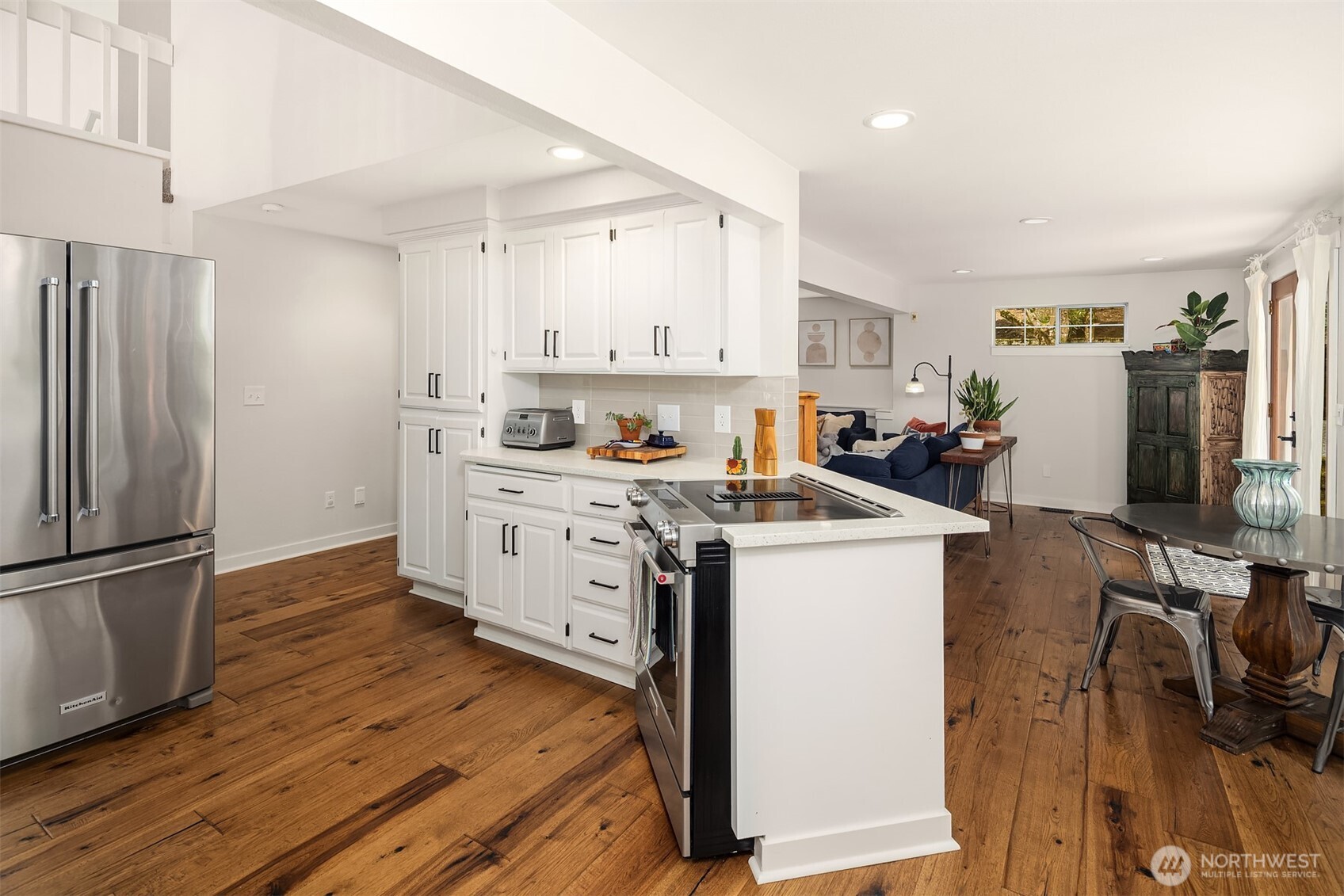 4938 Narbeck Avenue Everett, WA 98203 - Photo 10 of 40 a kitchen with a stove a refrigerator and wooden floor