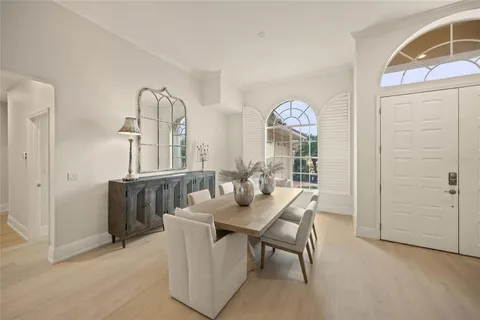 a kitchen with stainless steel appliances granite countertop a sink refrigerator and cabinets