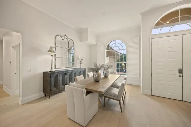 a kitchen with stainless steel appliances granite countertop a sink refrigerator and cabinets