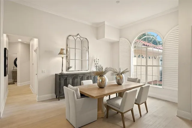 a kitchen with stainless steel appliances kitchen island granite countertop a stove a refrigerator and a sink with wooden floor