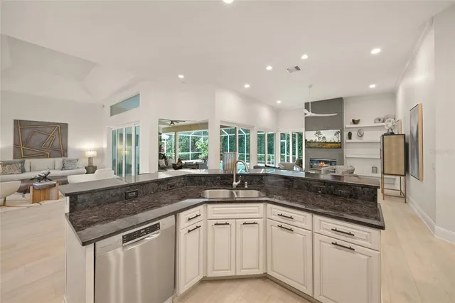 a bedroom with a white bed and a chandelier