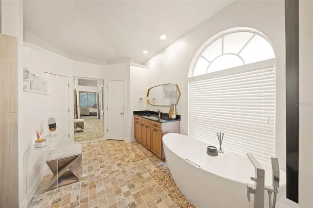 a view of a swimming pool with a yard in front of it