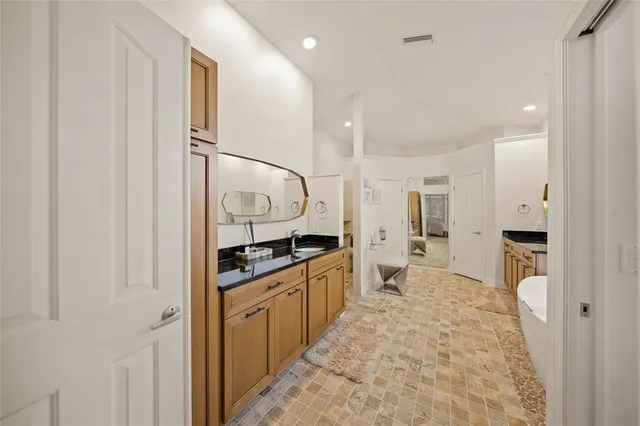 a view of a house with backyard porch and sitting area