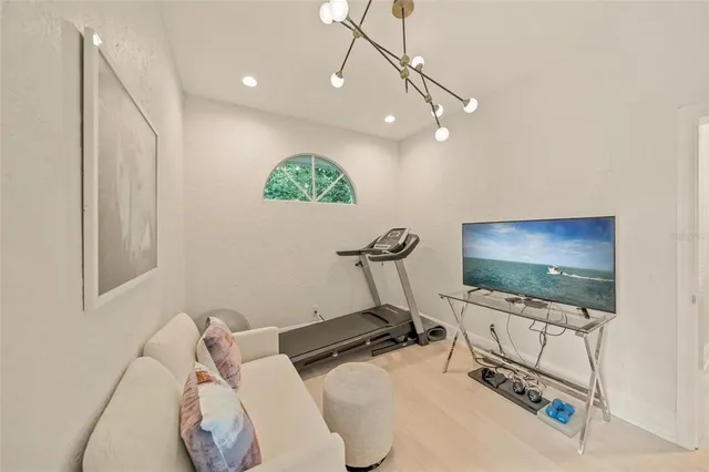 front view of a house with a tree in front of it