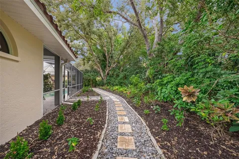 an aerial view of residential houses with outdoor space and river