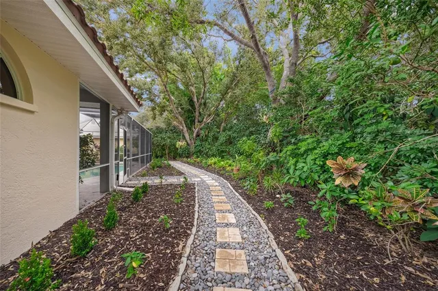 an aerial view of residential houses with outdoor space and river