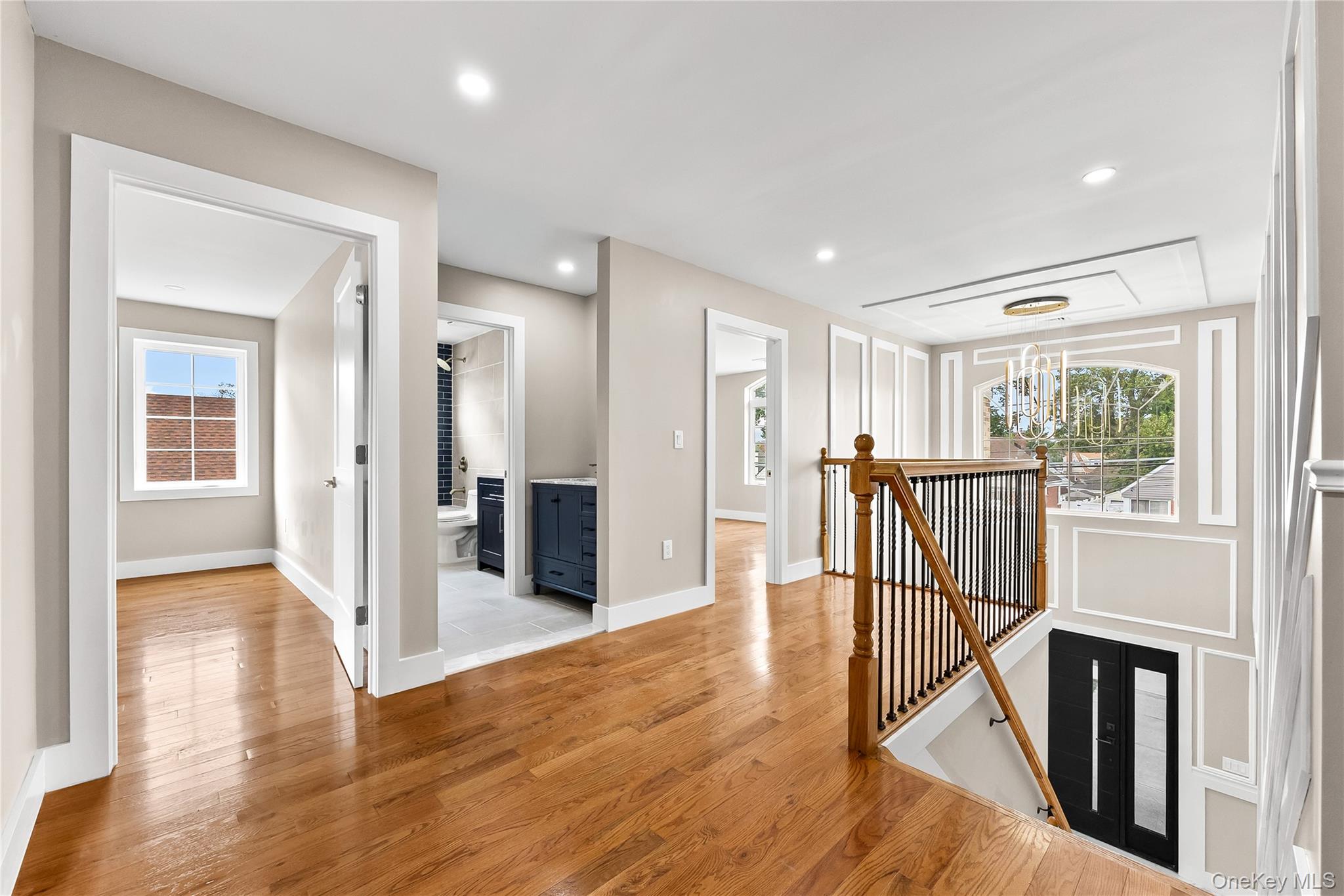 311 Lyon Street Valley Stream, NY 11580 - Photo 23 of 45 a view of a hallway with wooden floor and staircase