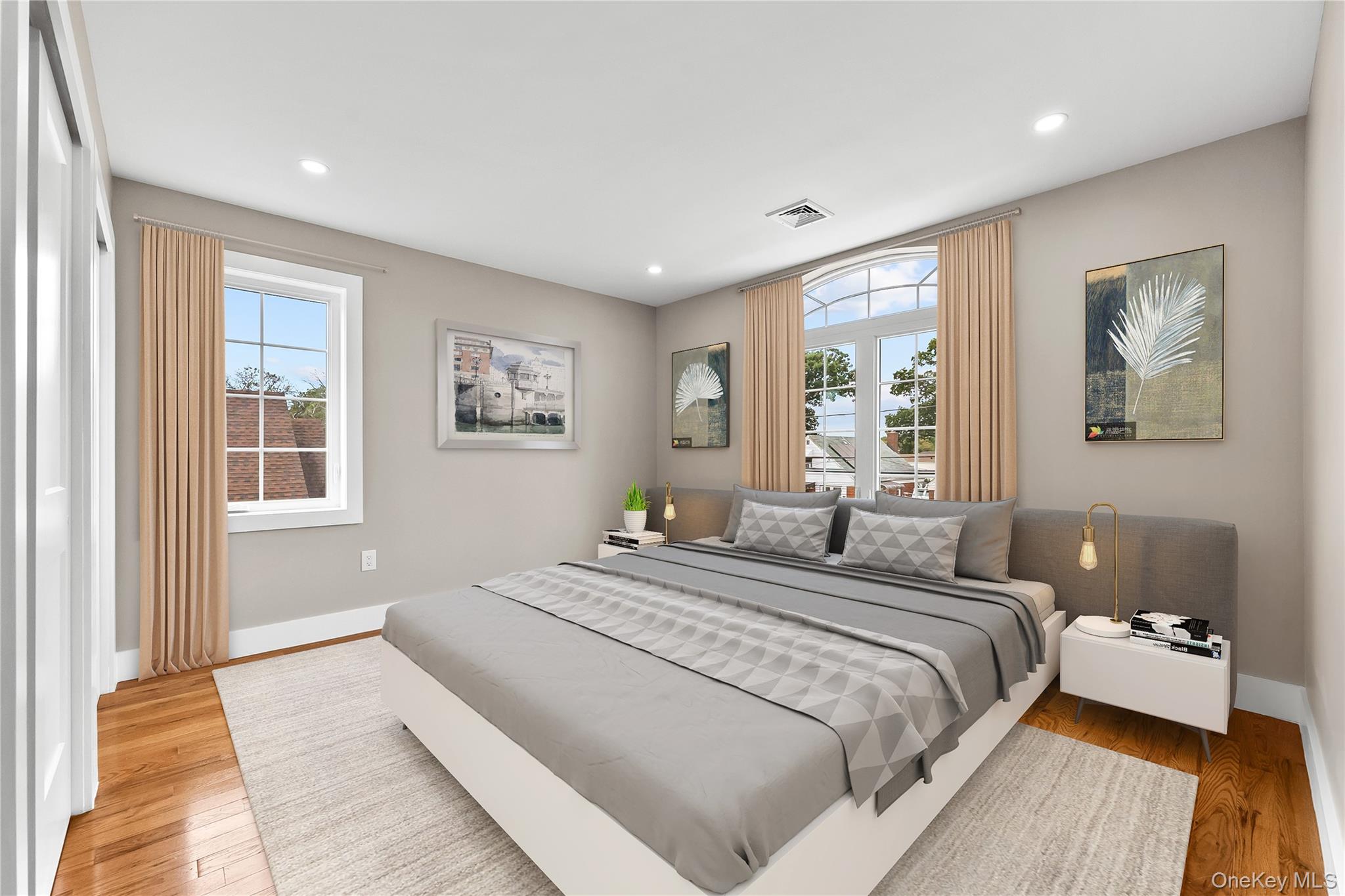 311 Lyon Street Valley Stream, NY 11580 - Photo 24 of 45 a bedroom with a large bed and a window