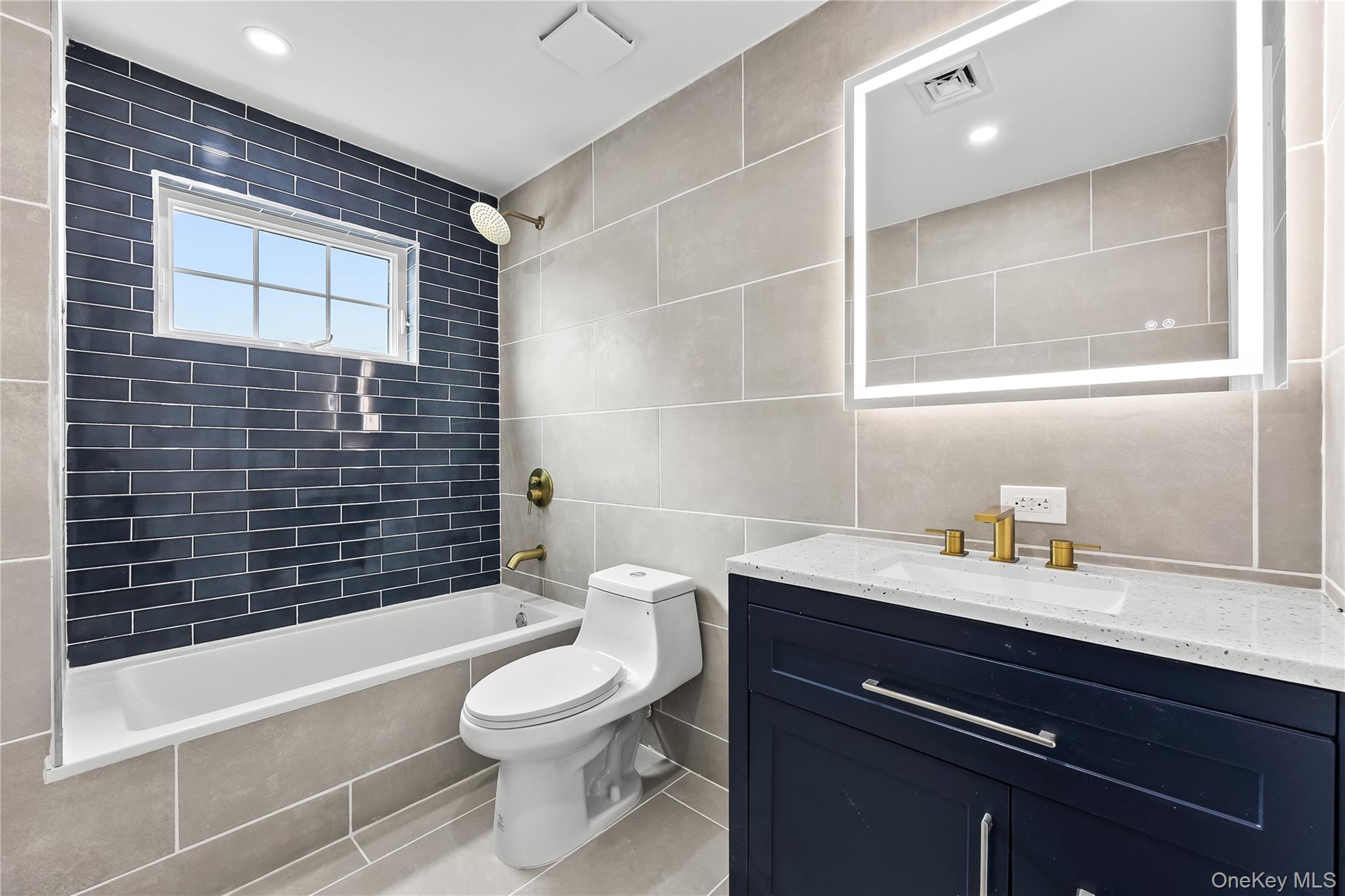 311 Lyon Street Valley Stream, NY 11580 - Photo 26 of 45 a bathroom with a sink a toilet and shower