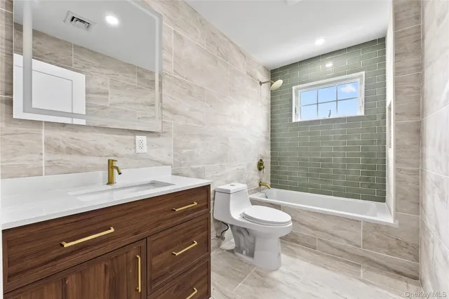 a bedroom with a large bed and a couch