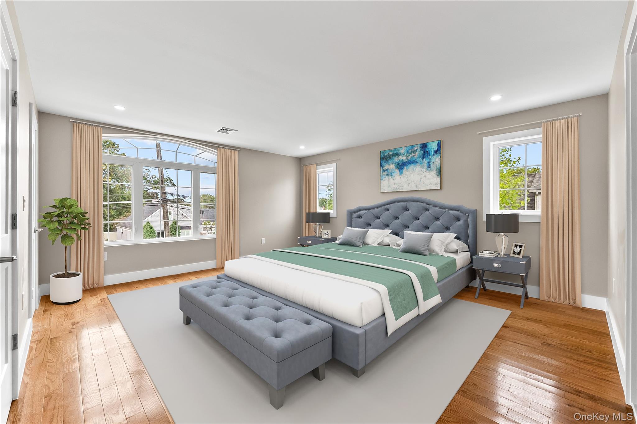 311 Lyon Street Valley Stream, NY 11580 - Photo 34 of 45 a bedroom with a large bed and a couch