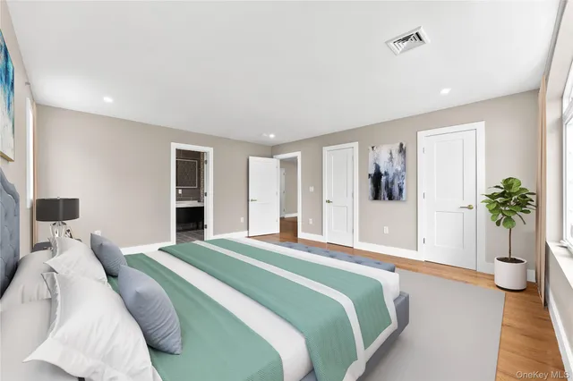 a bathroom with a sink toilet and mirror