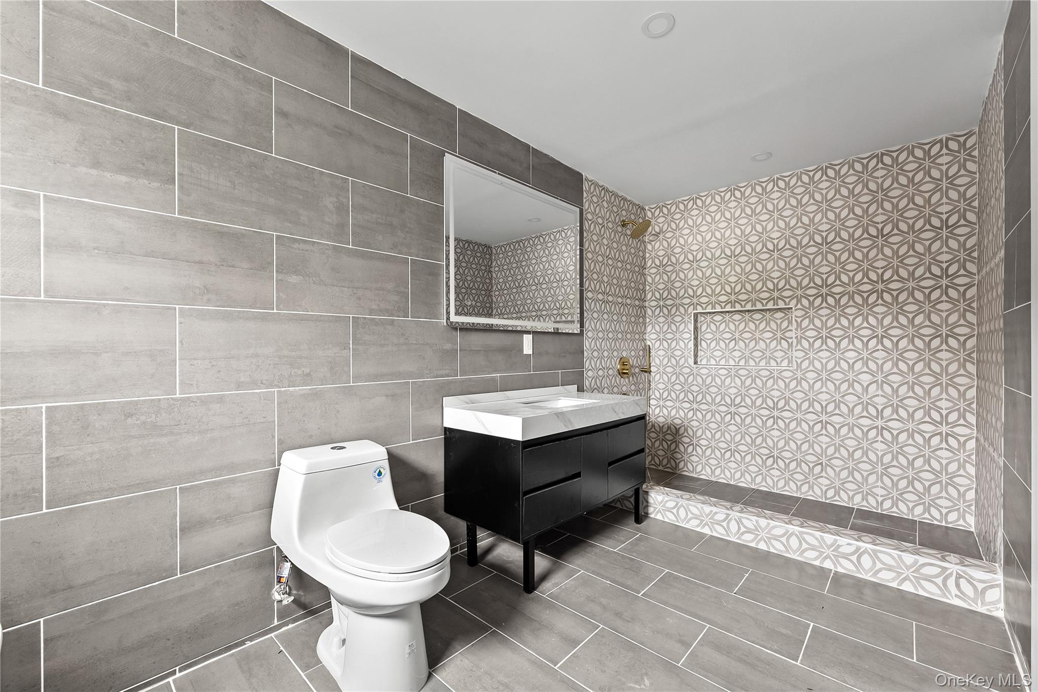 311 Lyon Street Valley Stream, NY 11580 - Photo 37 of 45 a bathroom with a sink toilet and shower