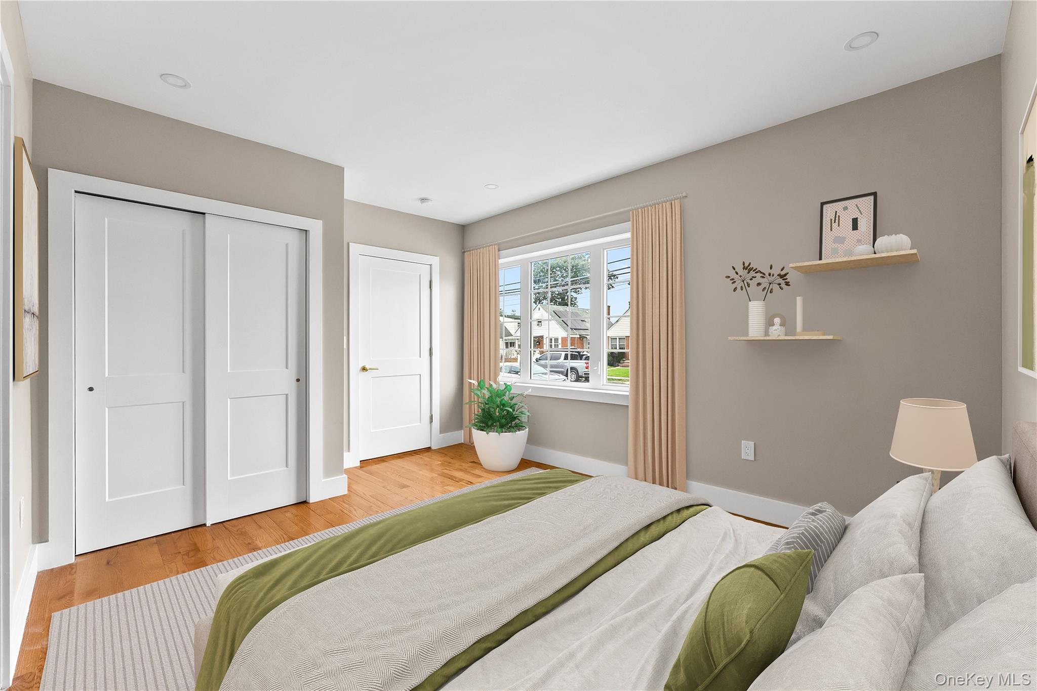 311 Lyon Street Valley Stream, NY 11580 - Photo 39 of 45 a bedroom with a bed and painting on the wall