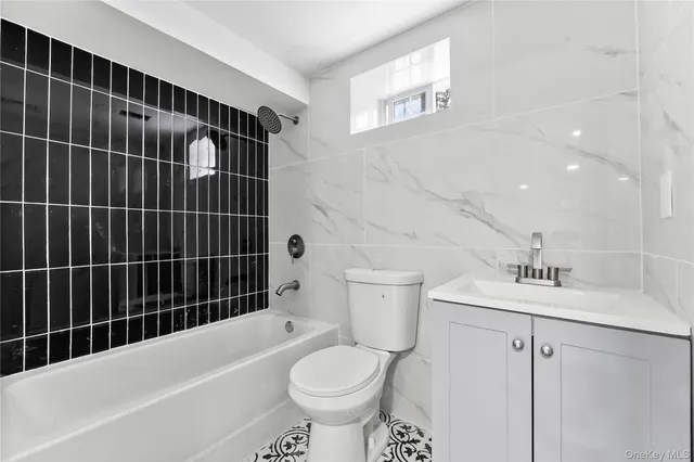 a living room with furniture and white walls