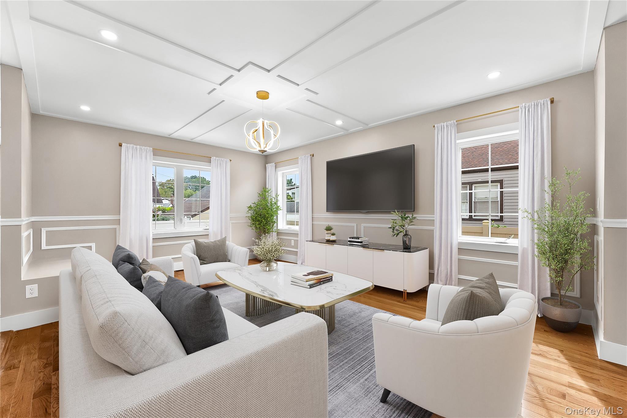311 Lyon Street Valley Stream, NY 11580 - Photo 10 of 45 a living room with furniture and a flat screen tv