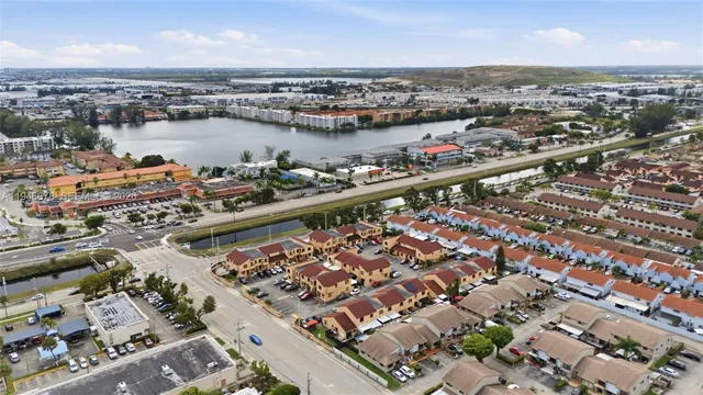 an aerial view of residential houses and outdoor space