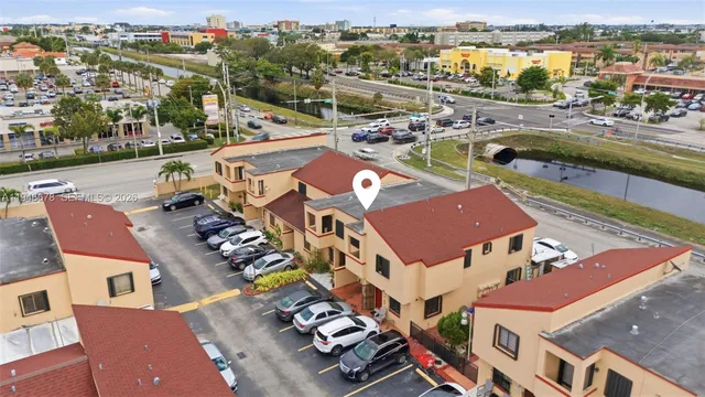 an aerial view of houses with outdoor space