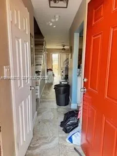 a room with lots of chairs and mirrors