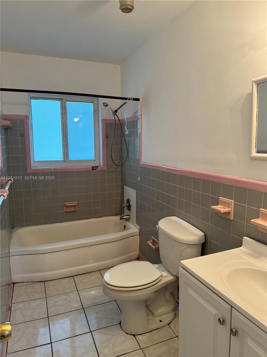 3535 Northwest 82nd Street Miami, FL 33147 - Photo 7 of 14 a bathroom with a toilet a sink and bathtub