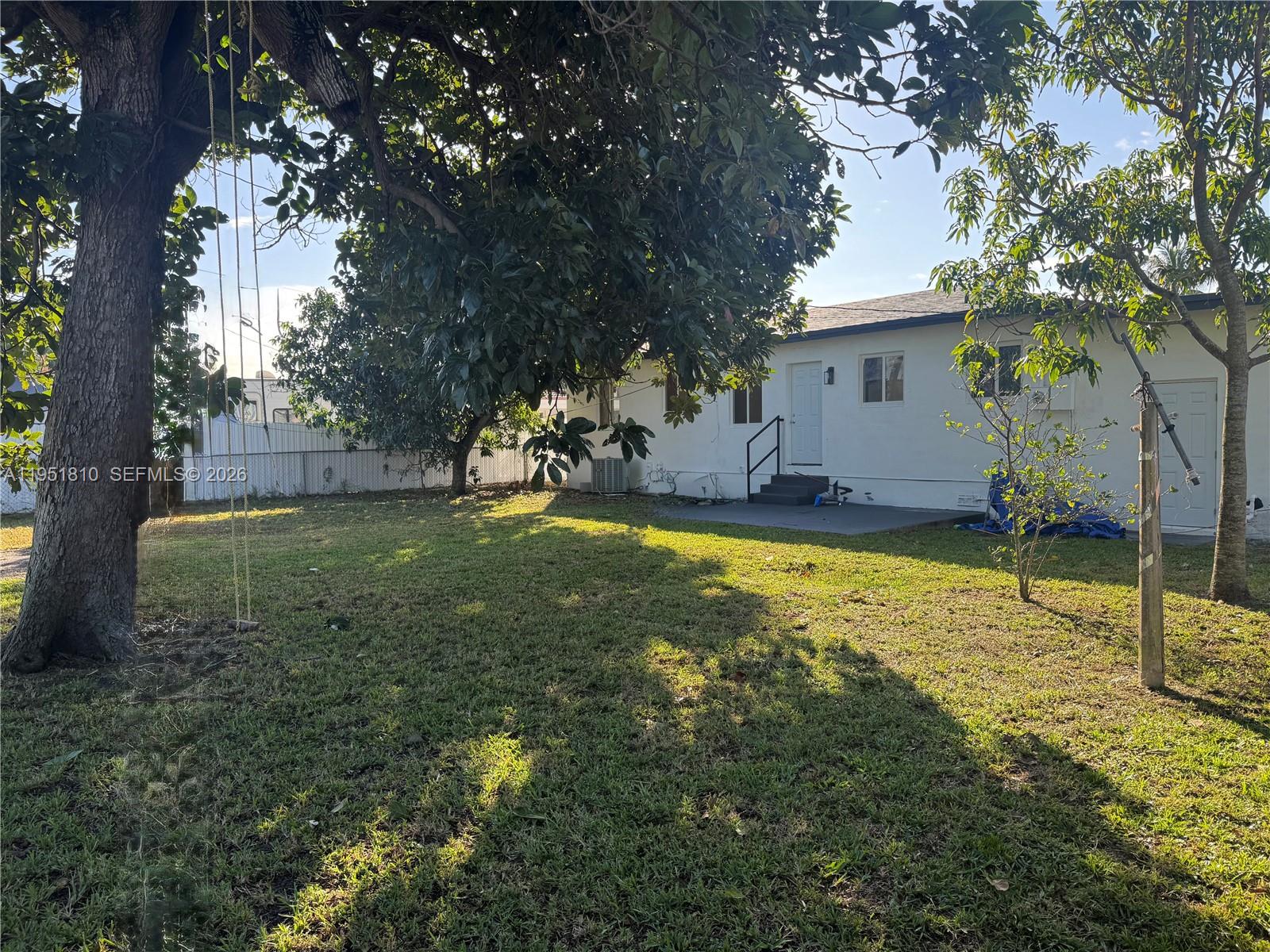 3535 Northwest 82nd Street Miami, FL 33147 - Photo 9 of 14 a view of a house with a yard