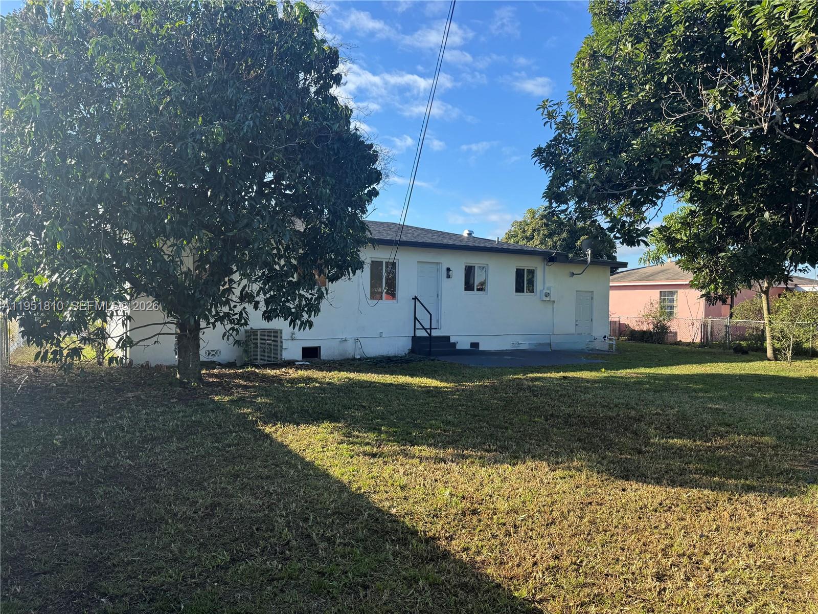 3535 Northwest 82nd Street Miami, FL 33147 - Photo 10 of 14 a view of a house with a yard